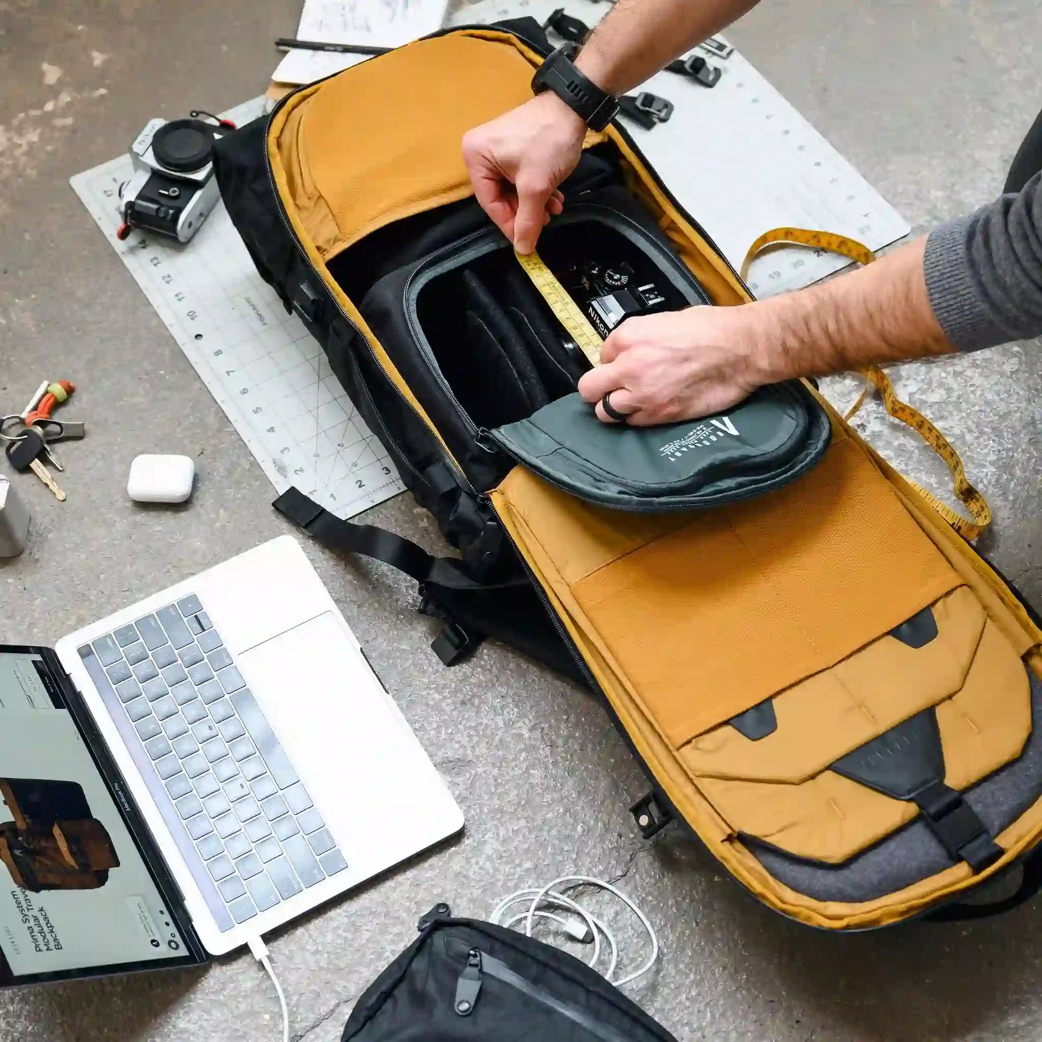 Golden-yellow interior of the weatherproof Jet-Black Errant pack by Boundary Supply.