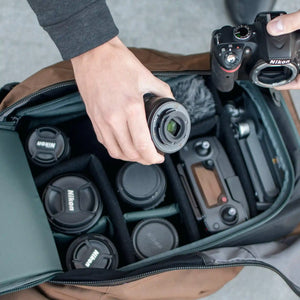 An open MK-1 Camera Cube full of camera lenses and equipment, all neatly organized.